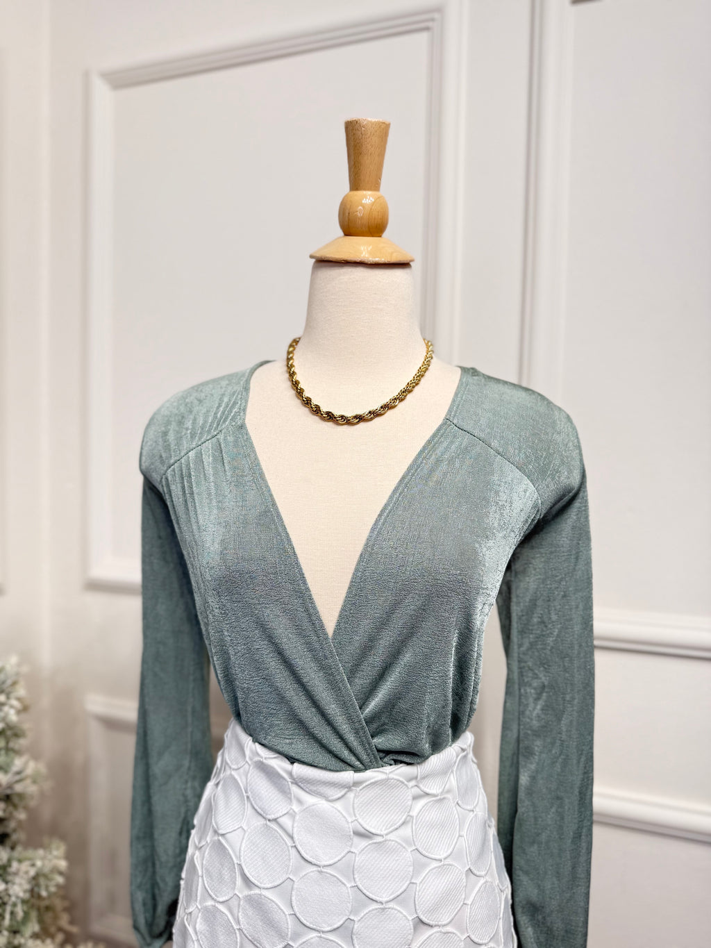 Soft green bodysuit