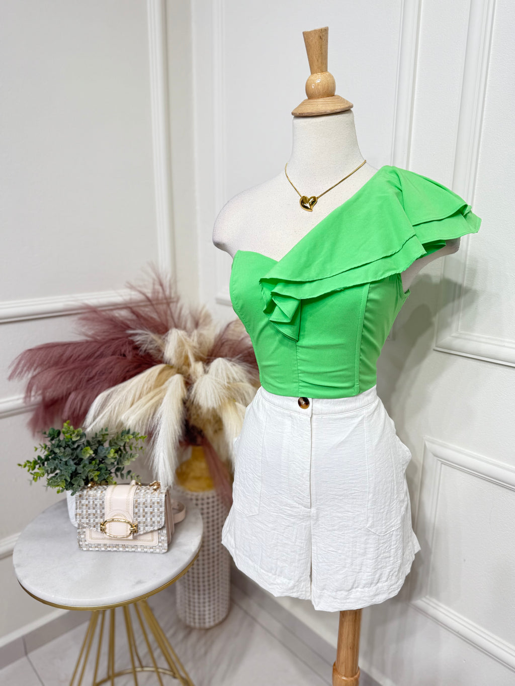 One shoulder green top