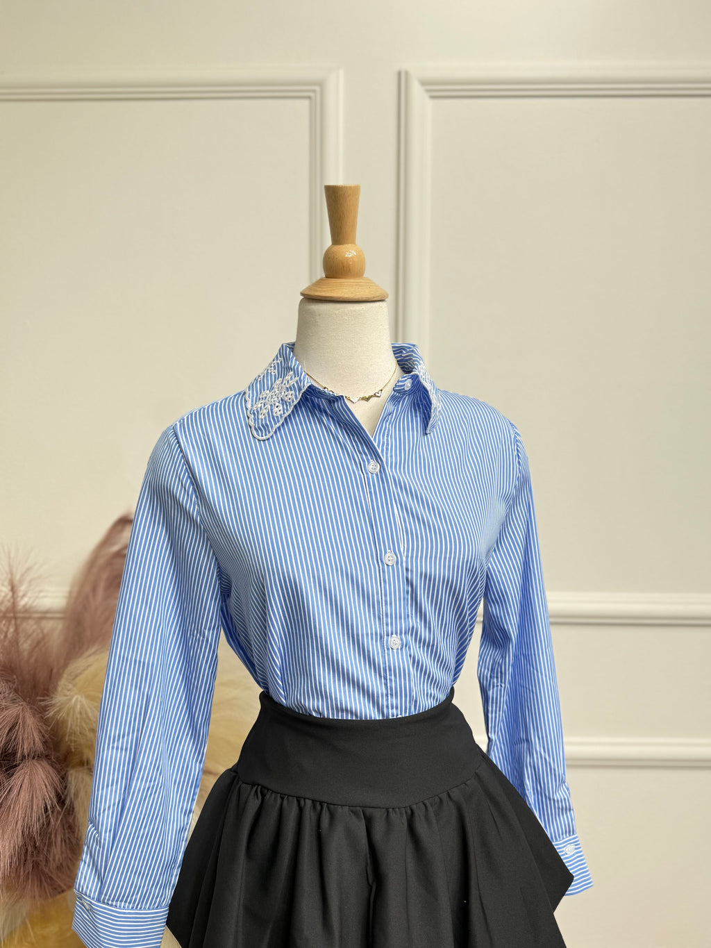 Darker blue blouse